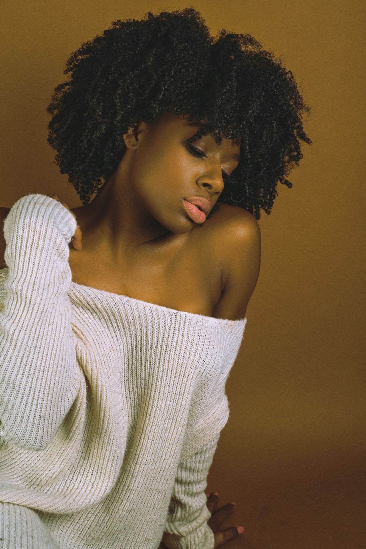 Beautiful woman in off-the-shoulder sweater.